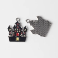 Front and back detail of alloy castle charm with black enamel and silver textured metal - Silver Base Castle