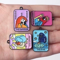 Handheld parrot tarot enamel charms for DIY necklaces showing The Empress and The Star designs - Random Mix
