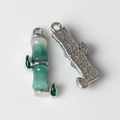 Detail of bamboo joint pendant with green gradient resin and star embossed pattern back - Silver Base Green 1