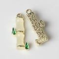 Macro shot of bamboo leaf pendant showing smooth jade resin texture and golden metal back - Gold Base Yellow