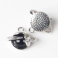Macro detail of planet-shaped pendants with black resin inlay and silver metal rings - Black