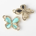 Detailed view of alloy resin butterfly connectors for DIY jewelry making with dual loops - Gold Base Blue