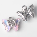 Macro view of pink crystal butterfly charms with silver frames for DIY jewelry - Silver Pink