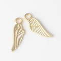 Detail of golden alloy feather charms with intricate embossed wing textures for DIY jewelry - Matte Gold