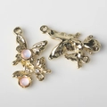 Detailed view of pink resin butterfly alloy connectors with rhinestones for DIY jewelry - Gold Base Pink