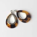Detailed view of amber tortoise resin waterdrop pendants with gold metal frames - Amber