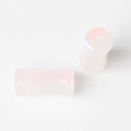 Detailed view of light pink translucent saddle ear plugs with smooth polished finish - Pink Bamboo