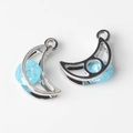 Detail of silver crescent moon charms with light blue resin inlay for jewelry making - Silver Base Blue