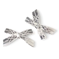 Close-up of silver bow charms with textured diamond pattern and metallic finish - Silver