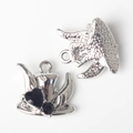 Detailed macro view showing front and back of silver alloy hat charms with black zircons - Silver/Black Zirconia
