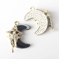 Detail of moon and star resin pendant with gold plating and cubic zirconia inlay - Gold Base Black