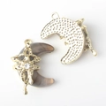 Detailed view of moon charms featuring resin inlay and gold star pattern with zircon - Gold Base Brown