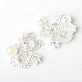 Macro detail of silver dragon pendants with pearl inlay for DIY jewelry making - Silver White
