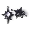 Detailed view of a black star-shaped alloy pendant with a sparkling square zircon inlay - Black with Pink Rhinestone