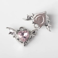 Macro detail of bat wing heart charms with pink crystal inlay for DIY jewelry making - Silver / Pink