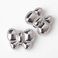 Detail of silver alloy bow beads with milgrain edges for DIY jewelry making and crafts - Silver