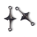 Close-up of dual-loop cross star jewelry connectors in polished black chrome alloy - Silver Black
