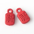 Detail of red rectangular Fu charm pendants with embossed Chinese characters for DIY jewelry - Red