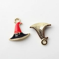 Detail of Halloween witch hat charms showing colorful enamel fronts and textured metal backs - Witch Hat