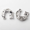 Detailed macro view of C-shaped silver alloy charms with crystal and honeycomb texture - Transparent / Silver Base