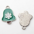 Detail of Christmas bell charms showing green enamel front and silver textured back - Green Bell Silver Base