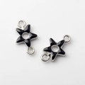 Detail of star-shaped alloy connectors with black enamel and silver-toned finish for DIY - Black