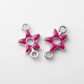 Close-up of rose red enamel star jewelry connectors with silver metal loops for DIY crafts - Rose Red