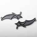 Detailed view of black enamel bat wing charms with dual rings for DIY jewelry crafting - Bat Wings