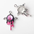 Detail of silver alloy evil eye pendant with pink glass eyeball and bat wings for DIY jewelry - Black Pink