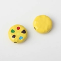 Macro shot of yellow alloy beads with colorful polka dots for DIY jewelry making - Yellow