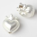 Macro view of matte silver crown heart charm with detailed hole for DIY jewelry making - Silver