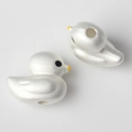Macro detail of bird-shaped beads with pearlescent finish and center hole for DIY jewelry - White