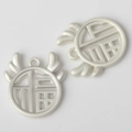 Close-up of matte silver Fu character hollow pendants with wing design for DIY jewelry - Matte Silver