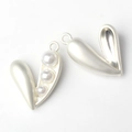 Macro detail of heart-shaped pearl pendant with matte silver alloy frame for DIY jewelry - Silver White Pearl