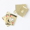 Macro detail of K Q A poker card charms with heart zircon for DIY jewelry crafts - Gold / White Zirconia