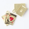 Detail view of gold alloy poker cards pendant with red heart rhinestone and back texture - Gold / Red