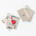 Macro view of silver playing card charms with red heart crystal and textured back - Silver / Red