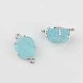 Detailaufnahme blauer Rosenanhänger aus Harz mit silberner Fassung für DIY-Schmuck - Blau