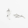Macro detail of irregular silver-colored thorn pendants for DIY jewelry making - White K/Silver