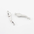 Polierter silberner Wellenverbinder für DIY-Schmuck mit Punkttextur und Doppelschleifen - 32mm / Silber