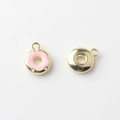 Macro detail of mini alloy enamel donut pendants with gold plating for DIY jewelry - Pink Gold Base