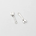 Detailed view of silver alloy mini wrench charms with realistic rotating nut design - Silver