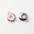 Macro view of mini donut alloy pendant with pink enamel and polished metallic back - Pink Silver Base