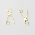 Macro detail of golden pliers-shaped alloy charms for DIY jewelry making and earring design - Bright Gold Plier Style / Gold