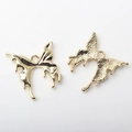 Detail view of alloy butterfly pendants in polished gold and hammered texture finishes - Gold