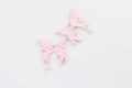 Detailed view of pink fluid-style butterfly charms with alloy texture and hanging holes - Pink