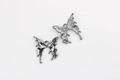 Detailed macro view showing polished front and matte back of butterfly charms - Gun Black