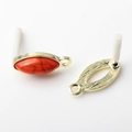 Detailed view of oval vintage alloy earring base with red stone and textured metal back - Red (Textured)