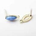 Detail of oval olive-shaped vintage alloy earring studs with blue marble pattern stones - Gray Blue (Textured)