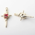 Macro detail of alloy cross pendant with ruby-red zircon and hammered gold texture - Gold Base Red Zirconia